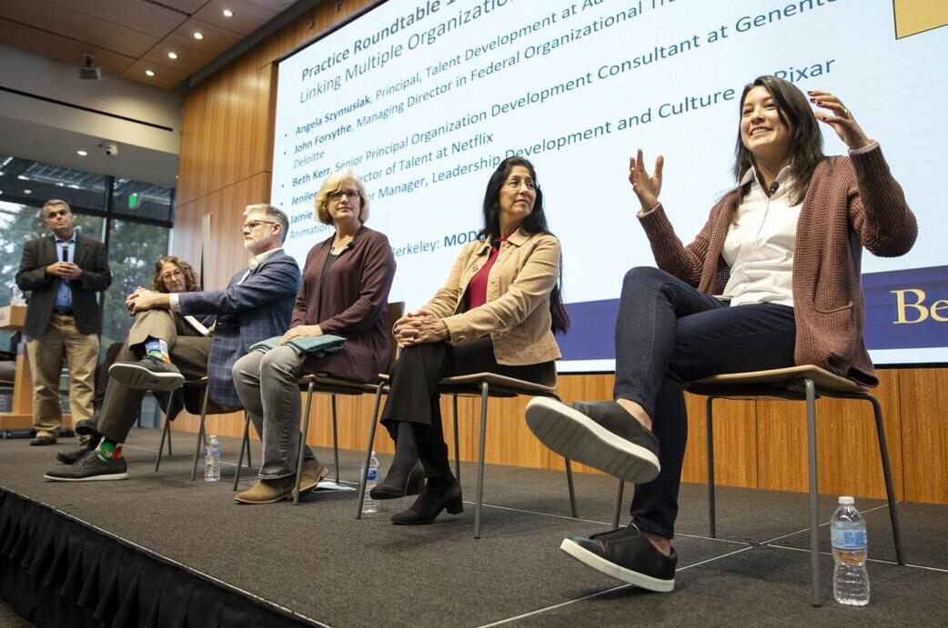 Panel of speakers at a conference