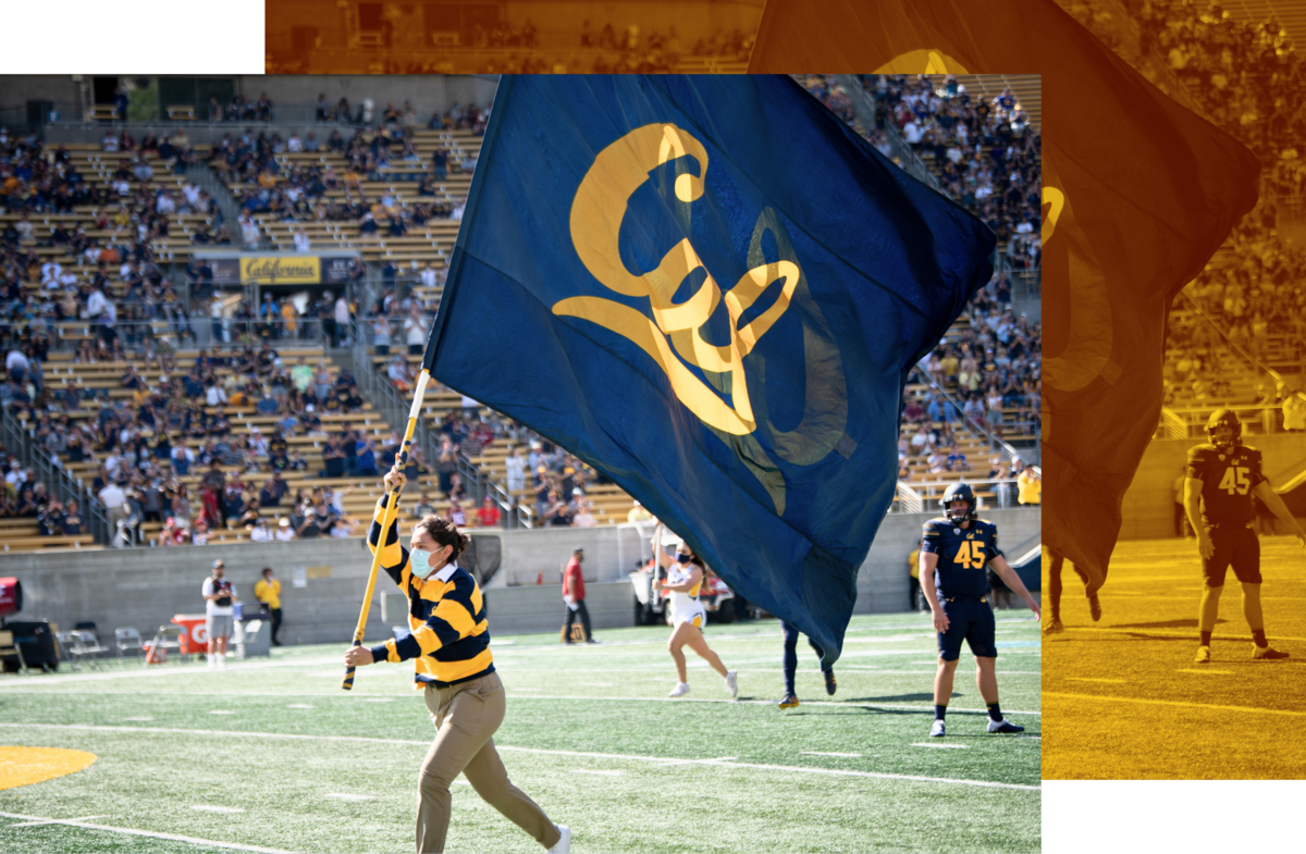 Photo of student running across football field waving Cal flag with yellow color block design in background.