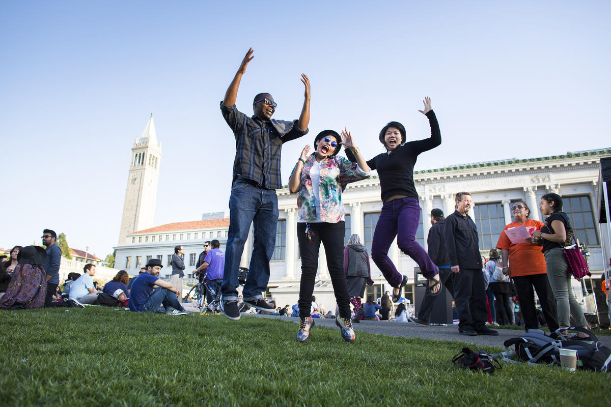 UC Berkeley students jump in excitement on Memorial Glade