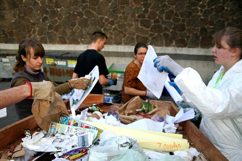 People looking through trash at a waste audit