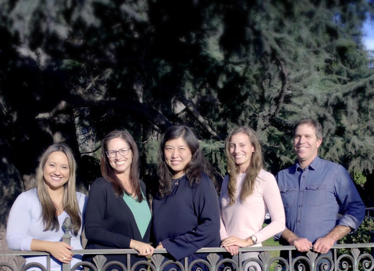 UBPS Team: Amber, Anissa, Jane, Amy, and Brandon standing behind the University of California sign