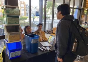 Sustainability students explain the new trash bin system