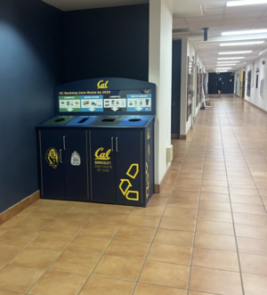 A UC Berkeley branded Max-R bin featuring separate slots for compost, mixed paper, landfill and recyclable materials.