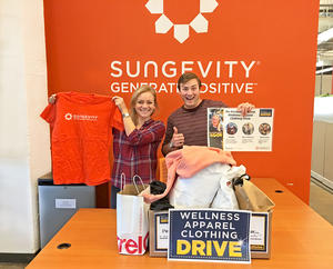 Sungevity employees pose with donated wellness apparel