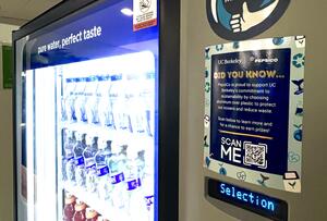 Sustainability + Health and Wellness sticker with a QR code placed on a vending machine
